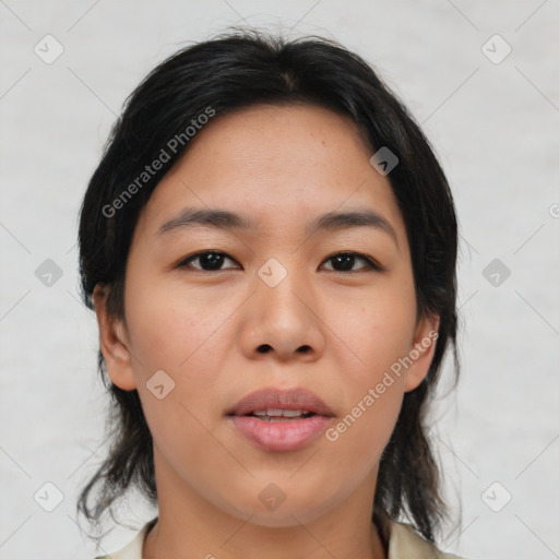 Joyful asian young-adult female with medium  black hair and brown eyes