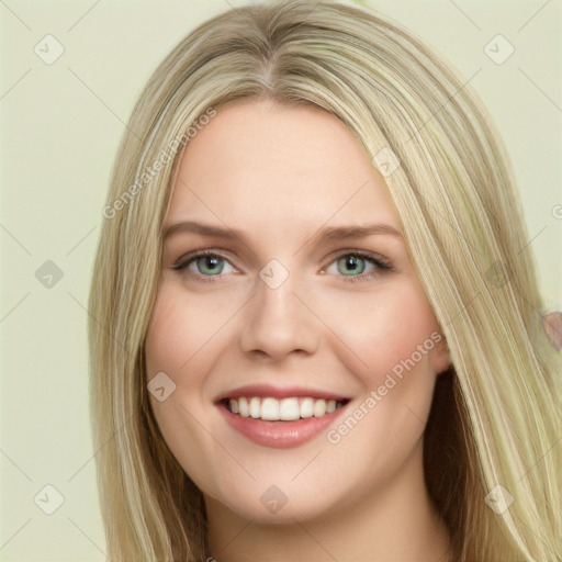 Joyful white young-adult female with long  brown hair and green eyes