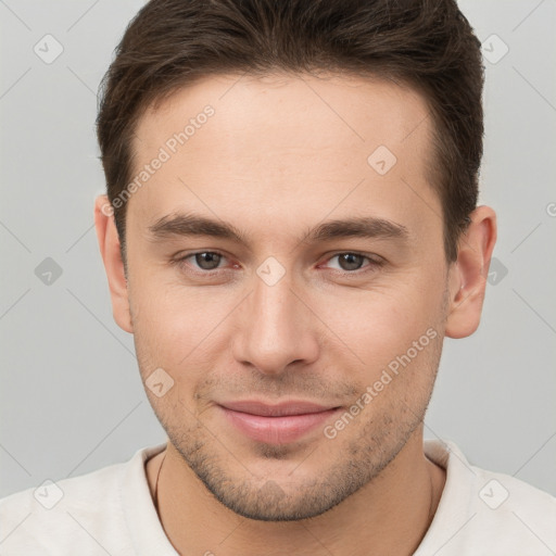 Joyful white young-adult male with short  brown hair and brown eyes