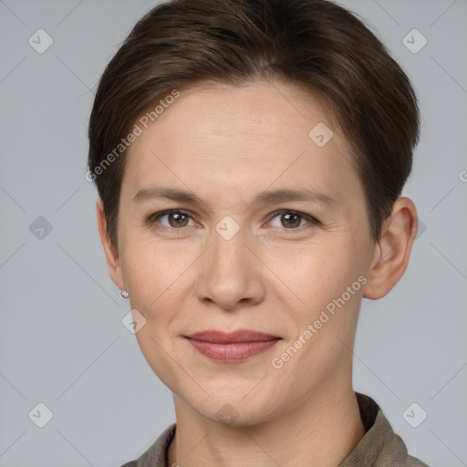 Joyful white adult female with short  brown hair and brown eyes