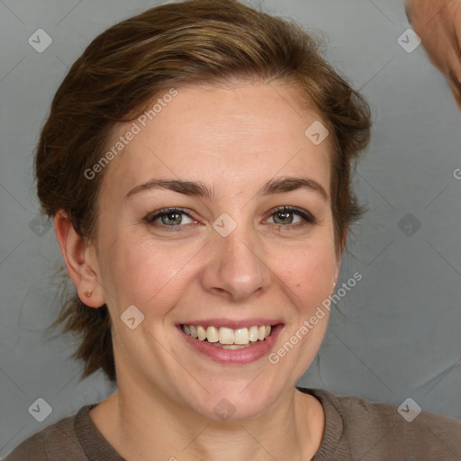 Joyful white young-adult female with medium  brown hair and grey eyes