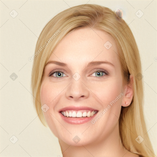 Joyful white young-adult female with long  brown hair and blue eyes