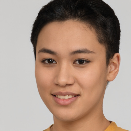 Joyful latino young-adult female with short  brown hair and brown eyes