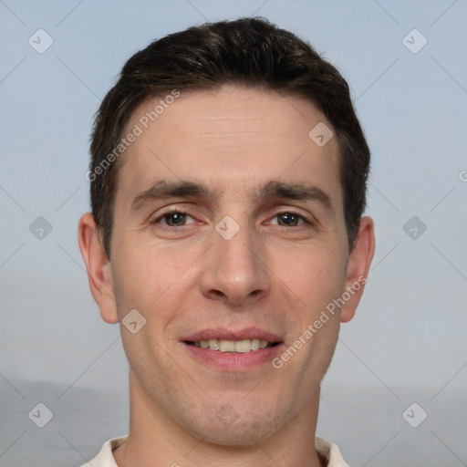 Joyful white adult male with short  brown hair and brown eyes