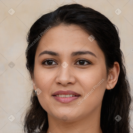 Joyful latino young-adult female with long  brown hair and brown eyes